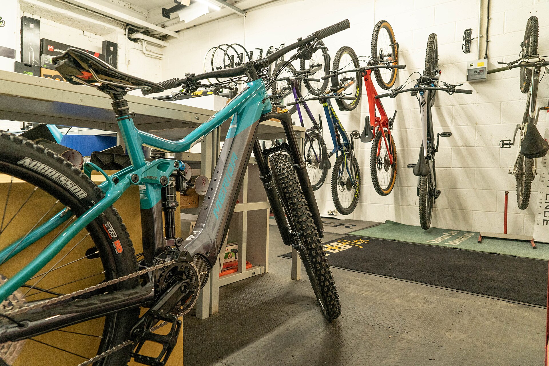 Wall of bicycles inside a repair shop