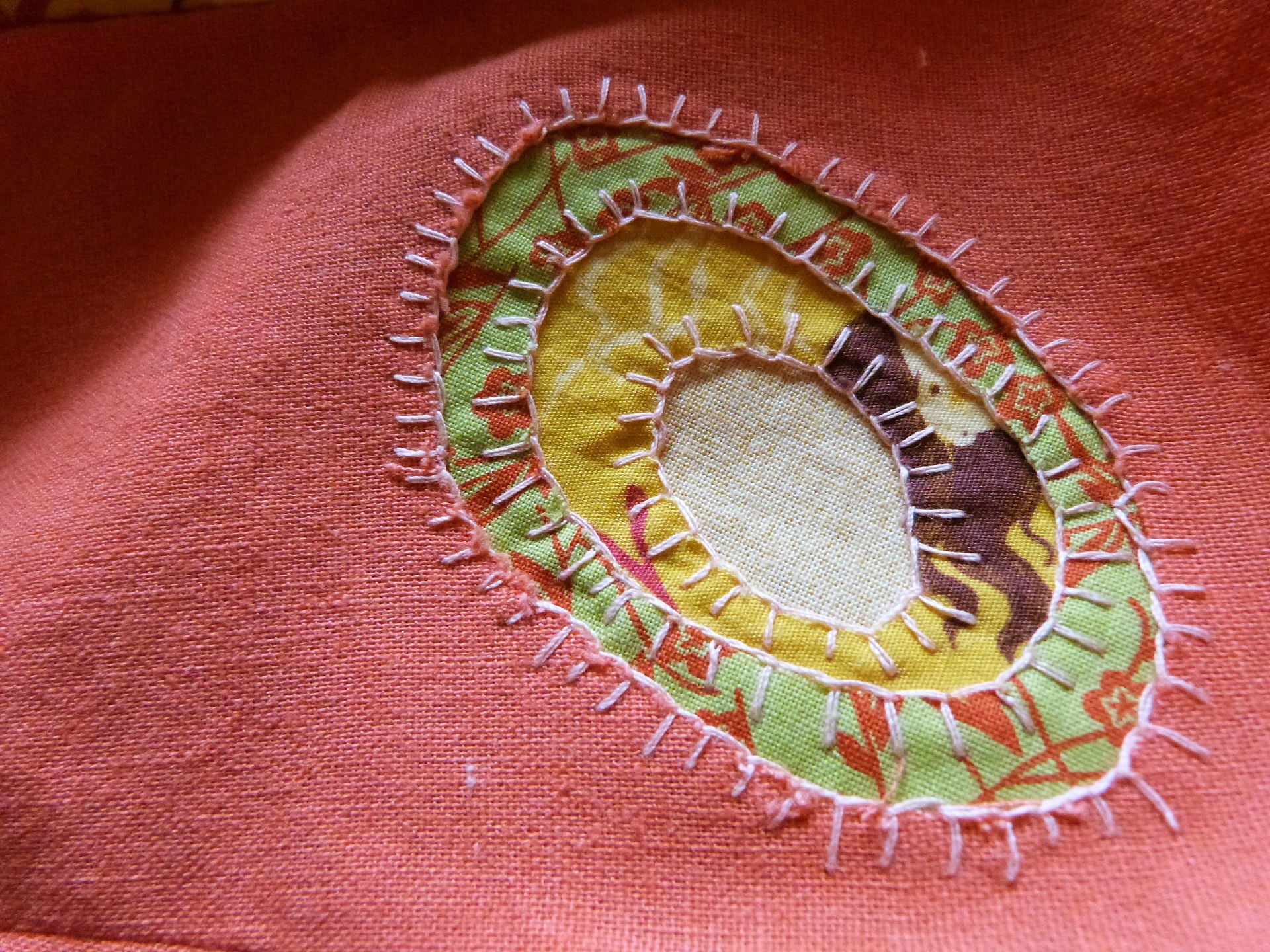 Linen dress detail with reverse applique